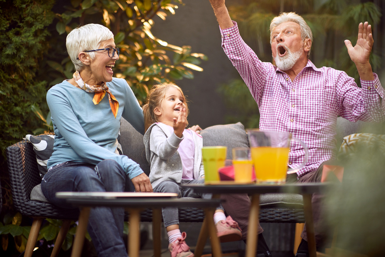 grandpa amusing granddaughter with her grandma