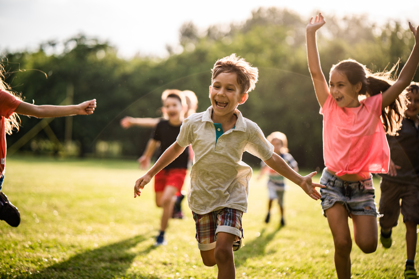 Happy children running in nature